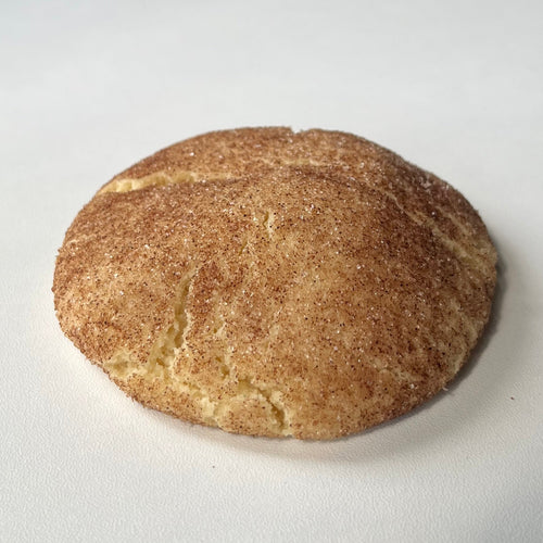 Snickerdoodle cookie on a white surface